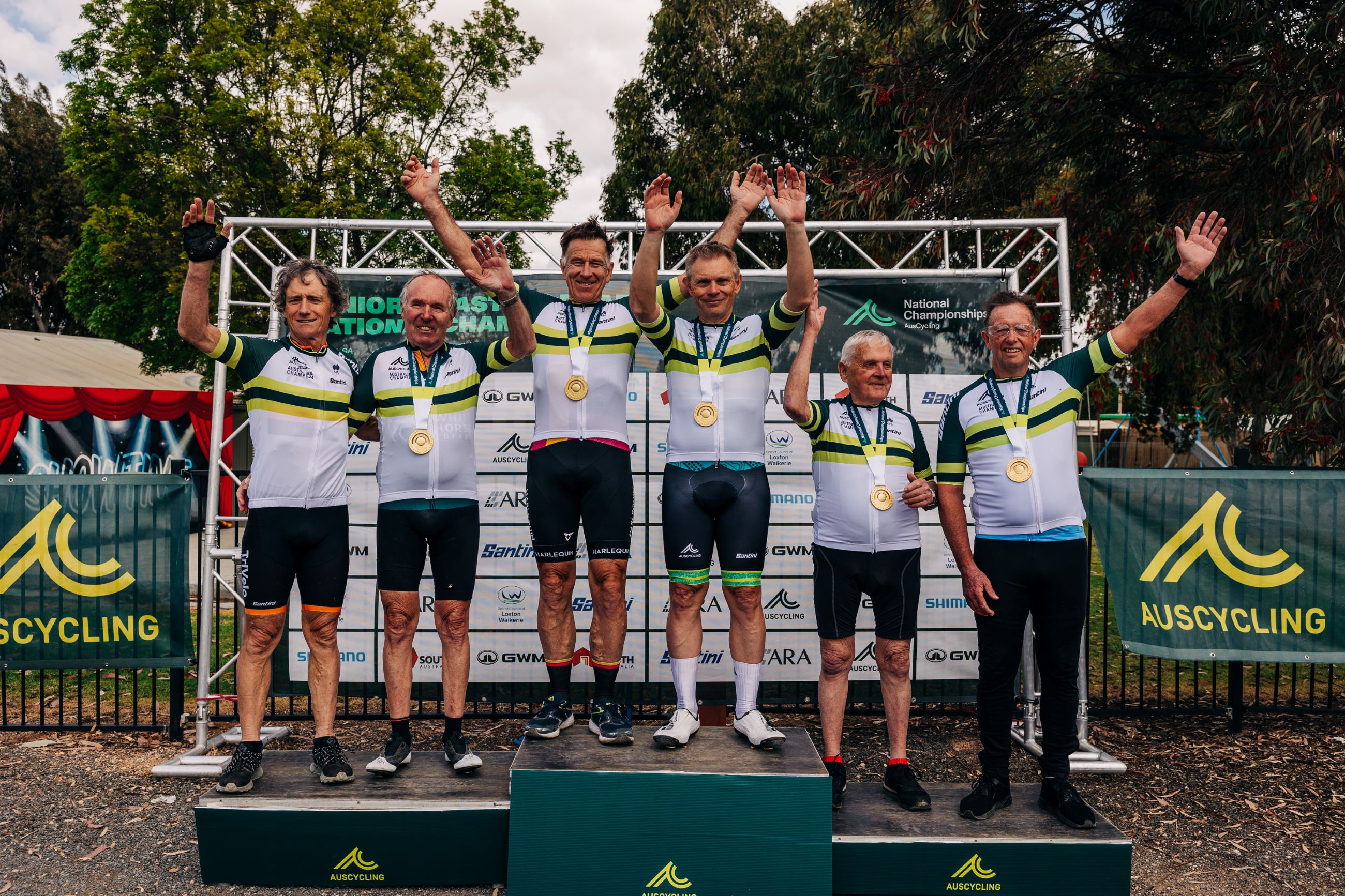 The winners of the men's masters 6, 7, 8, 9, 10 and an honorary 13 category on the podium after the road race at the 2024 AusCycling Masters and Junior Road National Championships in Loxton